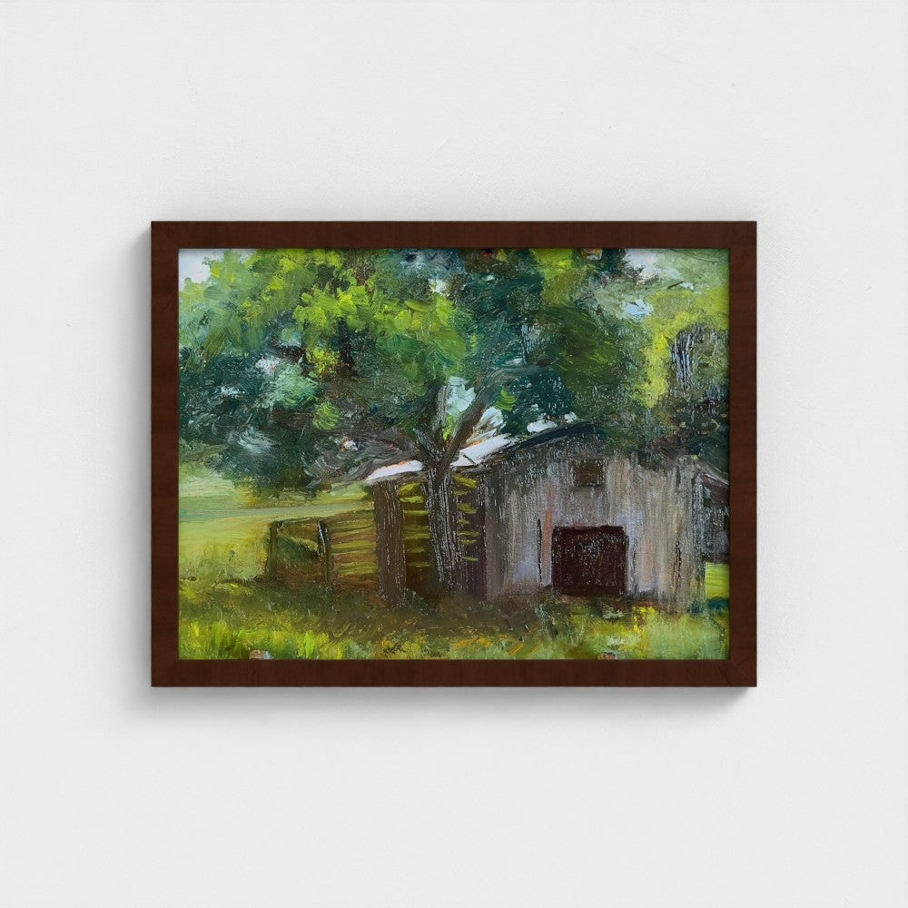Impressionist painting of a weathered barn with green trees and warm golden light