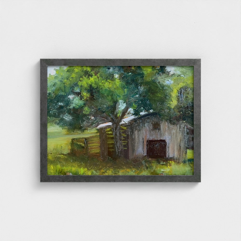 Impressionist painting of a weathered barn with green trees and warm golden light