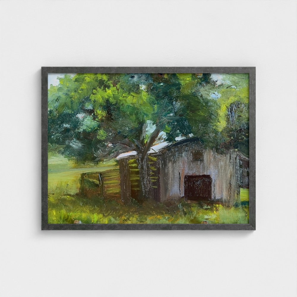 Impressionist painting of a weathered barn with green trees and warm golden light
