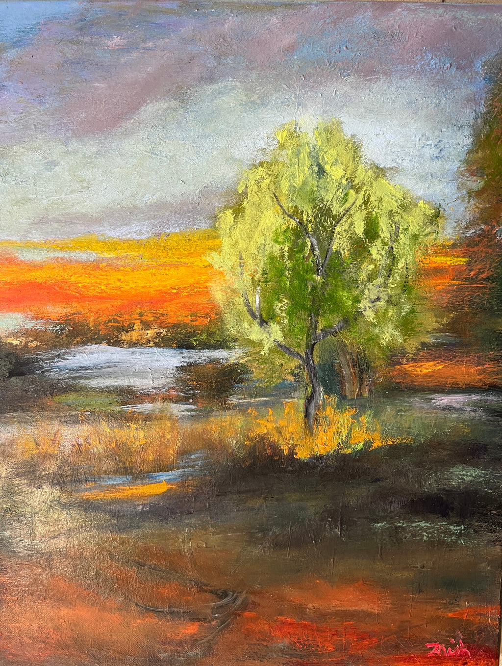 Impressionist painting of a bright green spring tree with golden sunset light over land and water